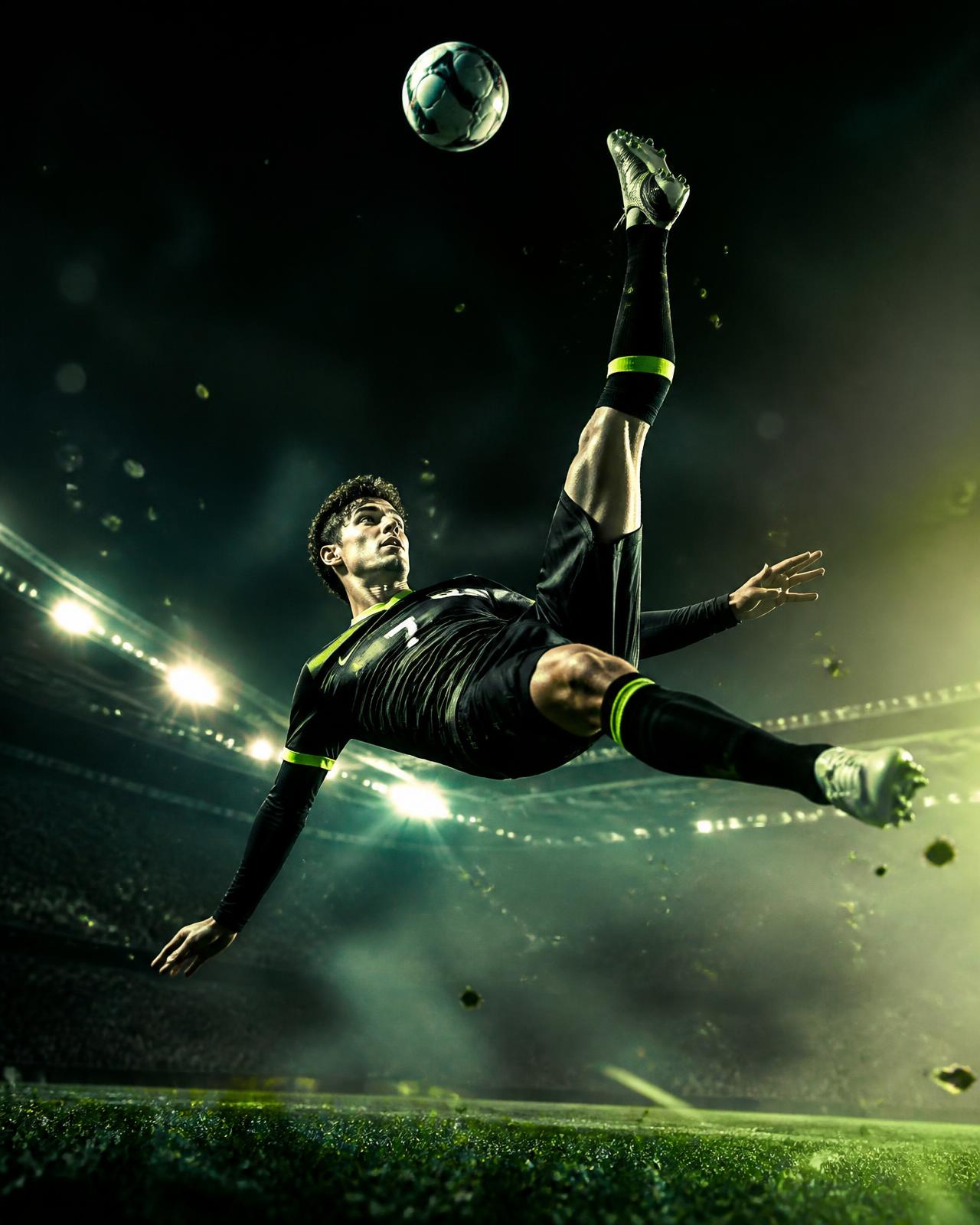 Footballer frozen mid bicycle kick under stadium floodlights